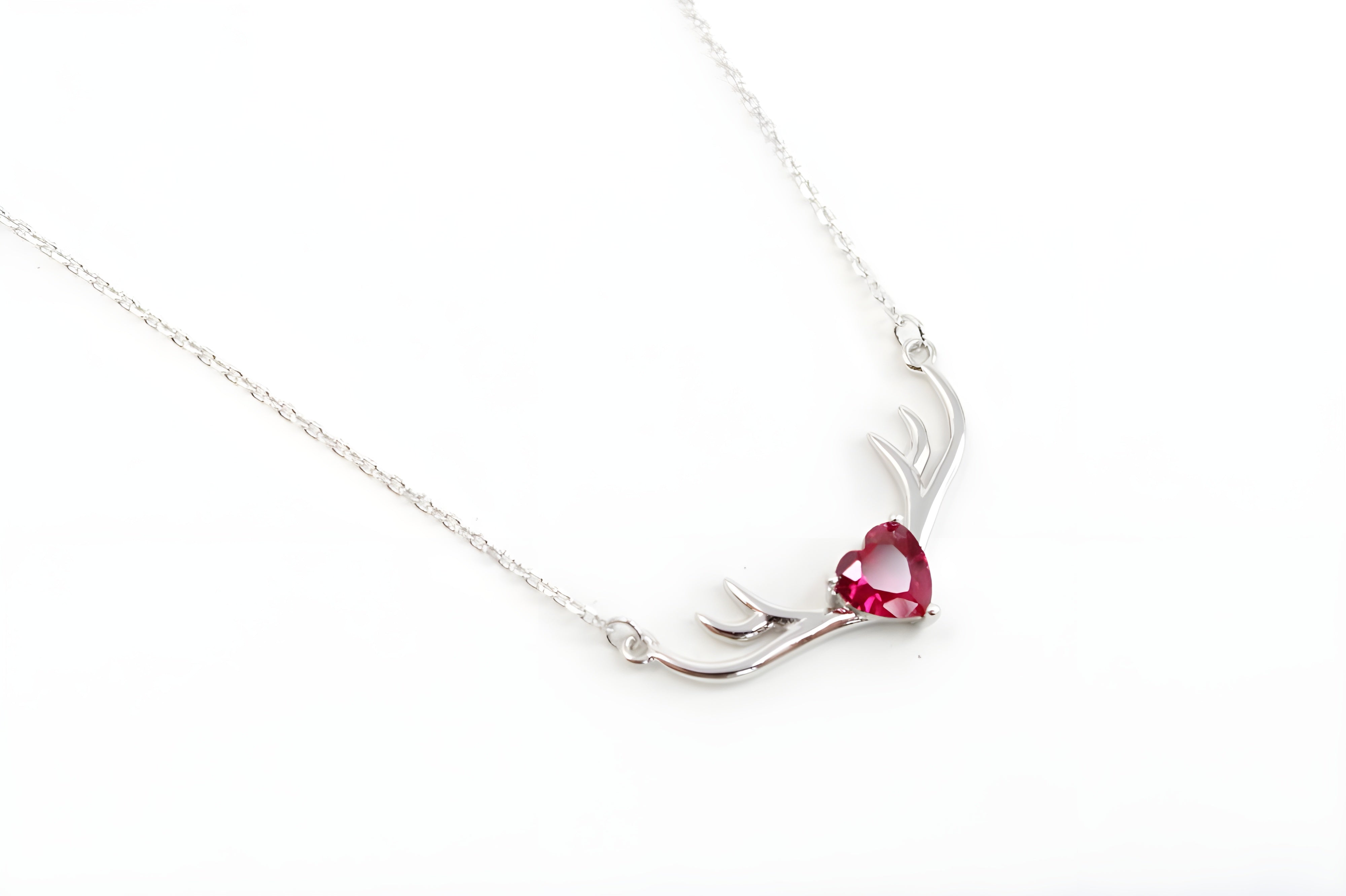 VeeLux Crystal Heart Pendant Nestled Between Sterling Silver Antlers