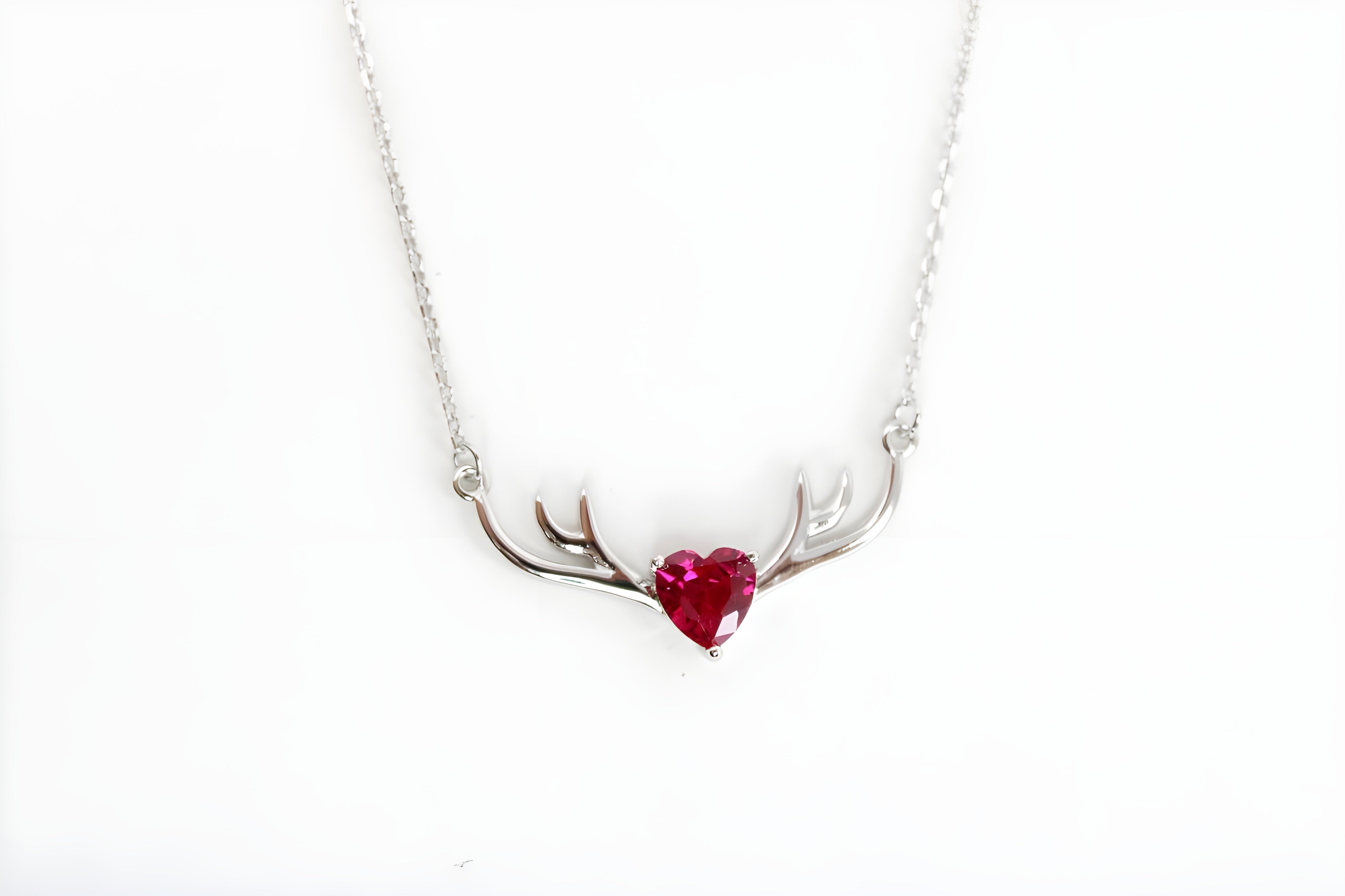 VeeLux Crystal Heart Pendant Nestled Between Sterling Silver Antlers