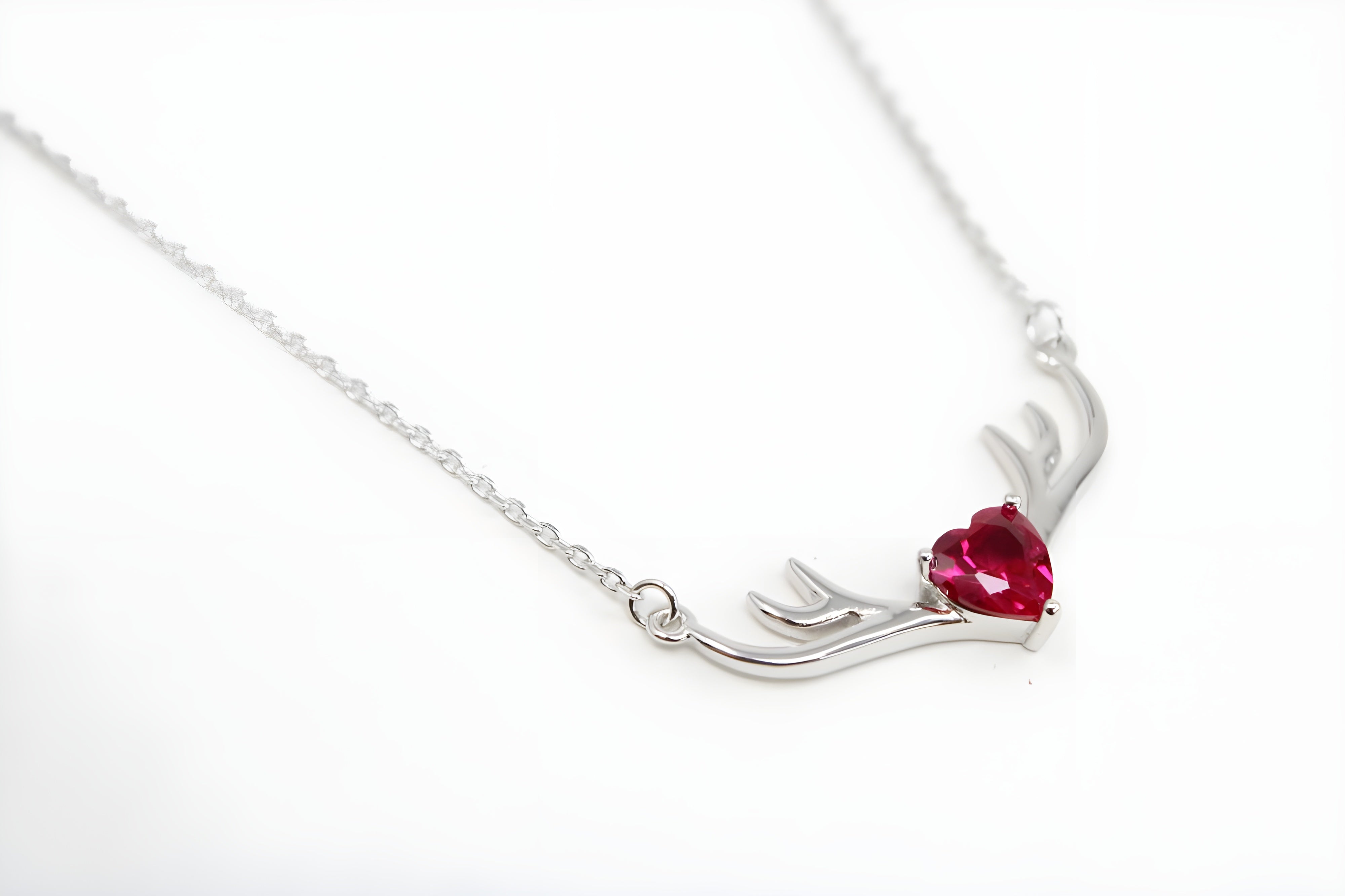 VeeLux Crystal Heart Pendant Nestled Between Sterling Silver Antlers