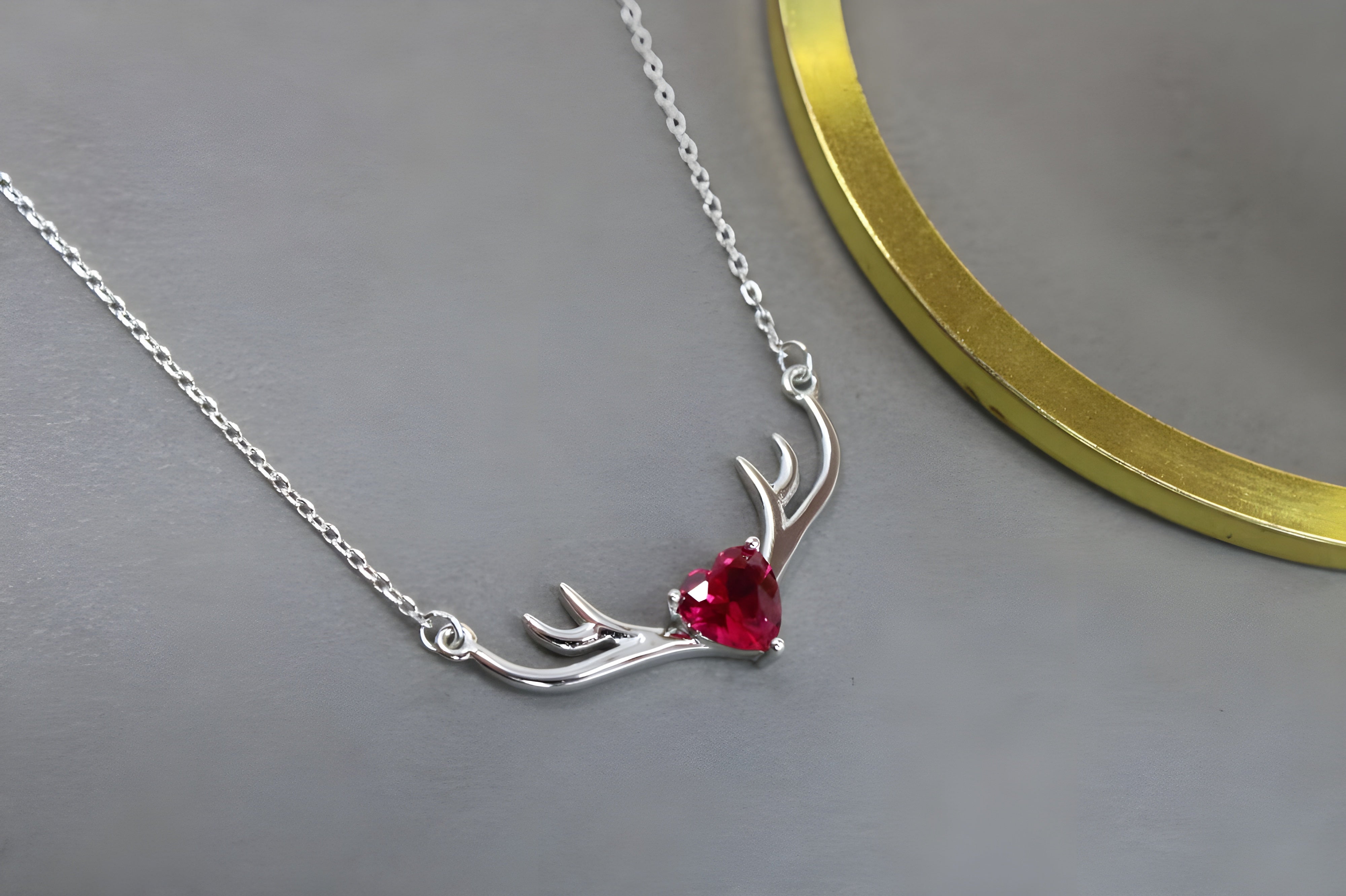 VeeLux Crystal Heart Pendant Nestled Between Sterling Silver Antlers