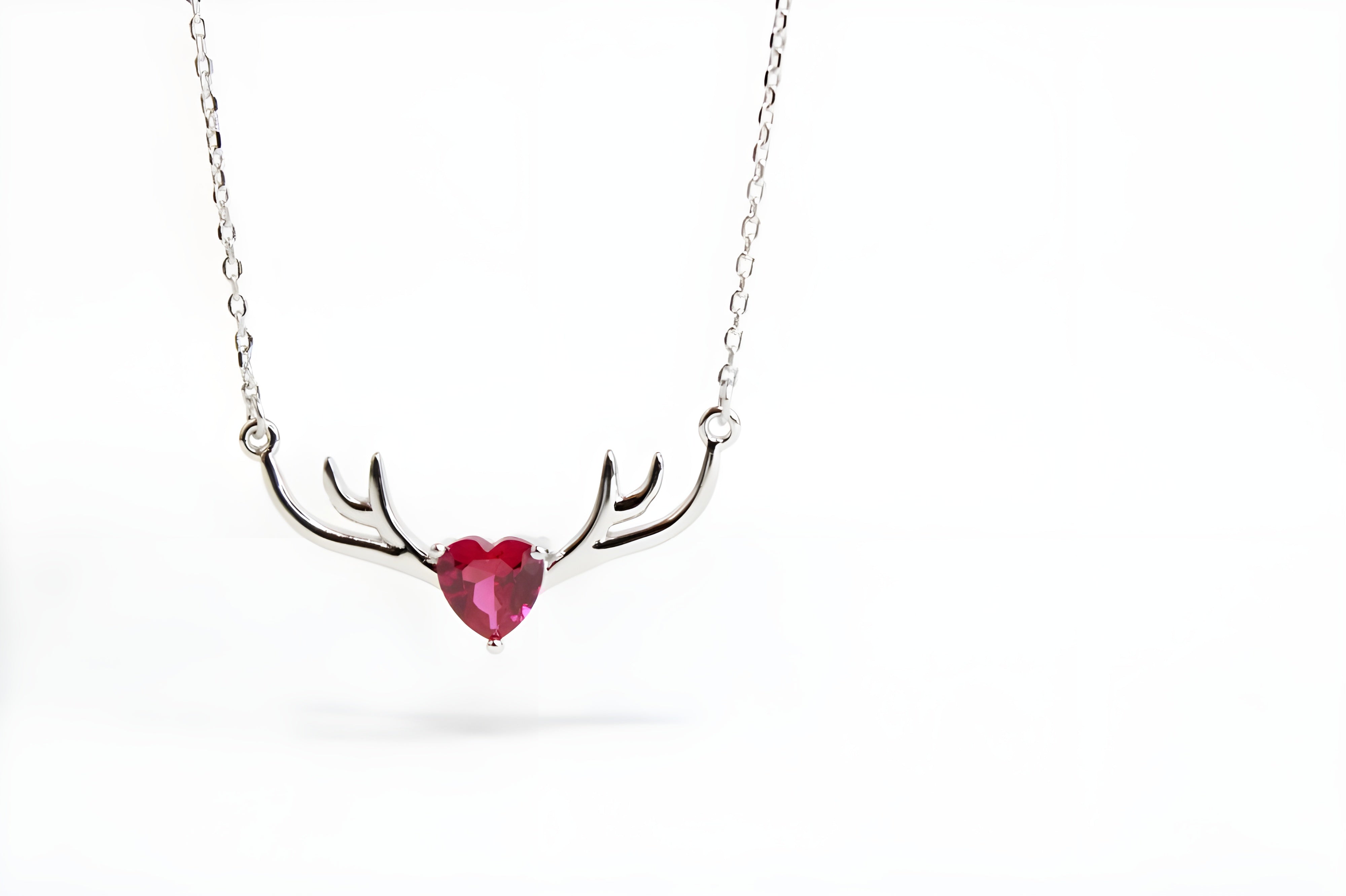 VeeLux Crystal Heart Pendant Nestled Between Sterling Silver Antlers