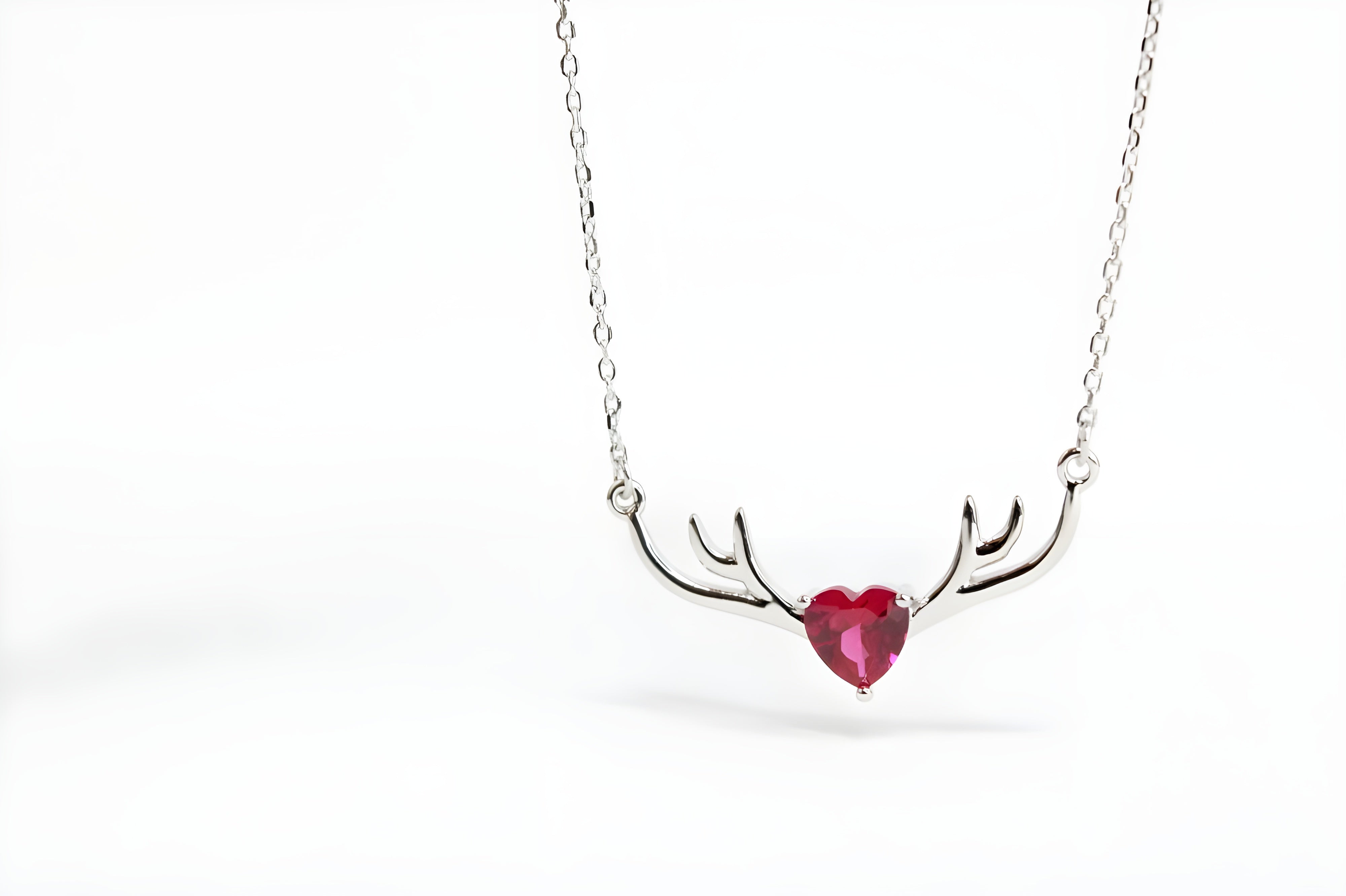 VeeLux Crystal Heart Pendant Nestled Between Sterling Silver Antlers