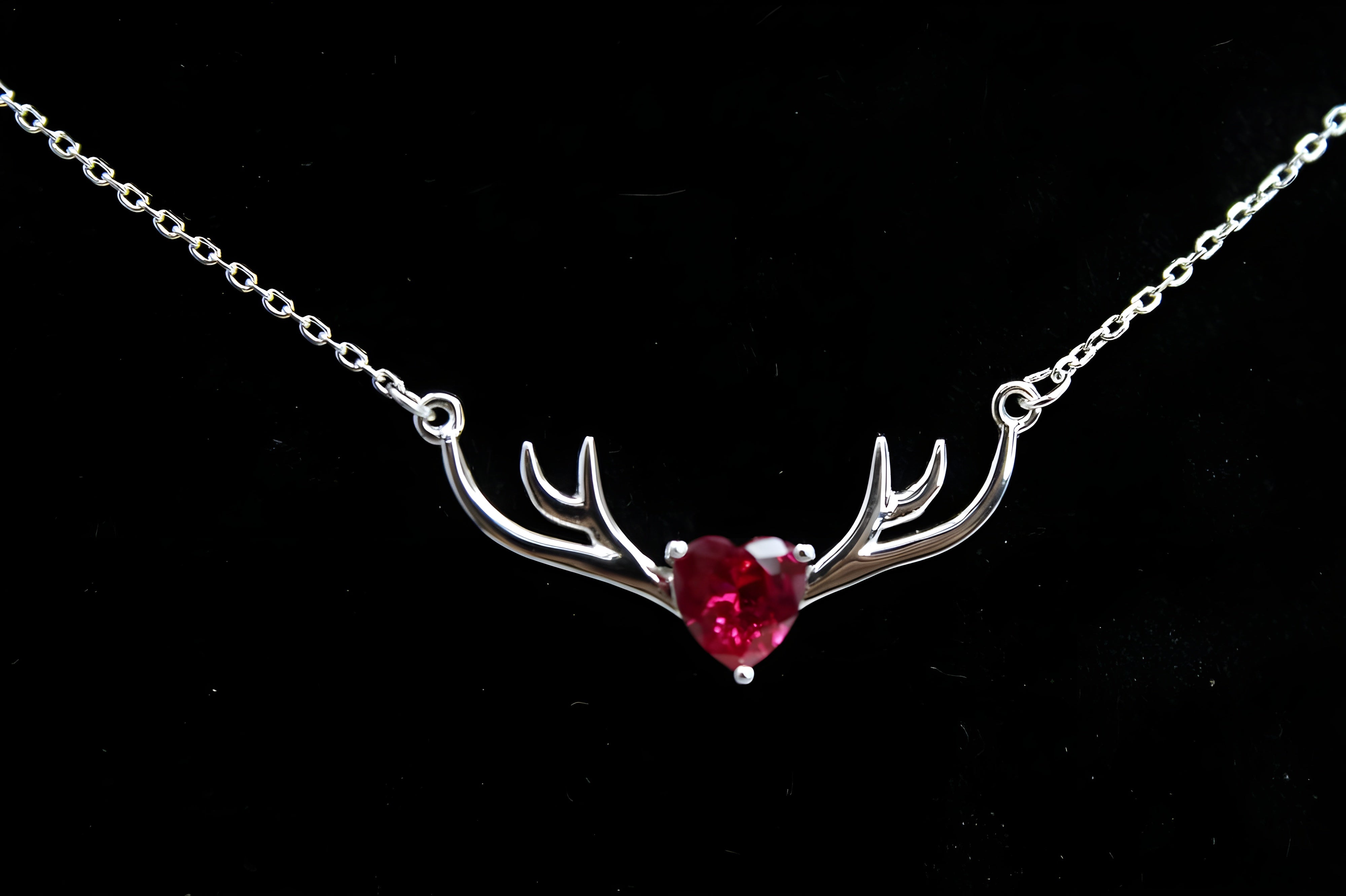 VeeLux Crystal Heart Pendant Nestled Between Sterling Silver Antlers