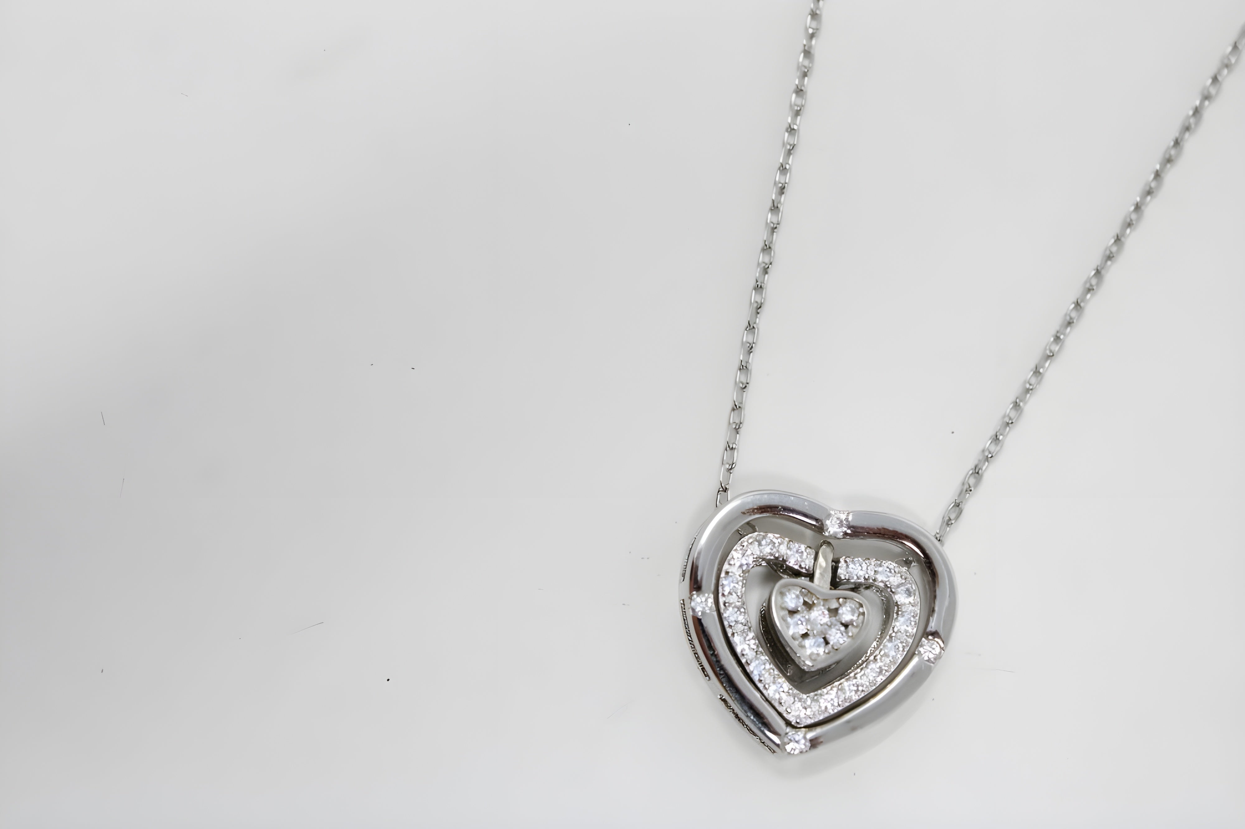 Interlocking Hearts Pendant in Premium Silver and Crystals