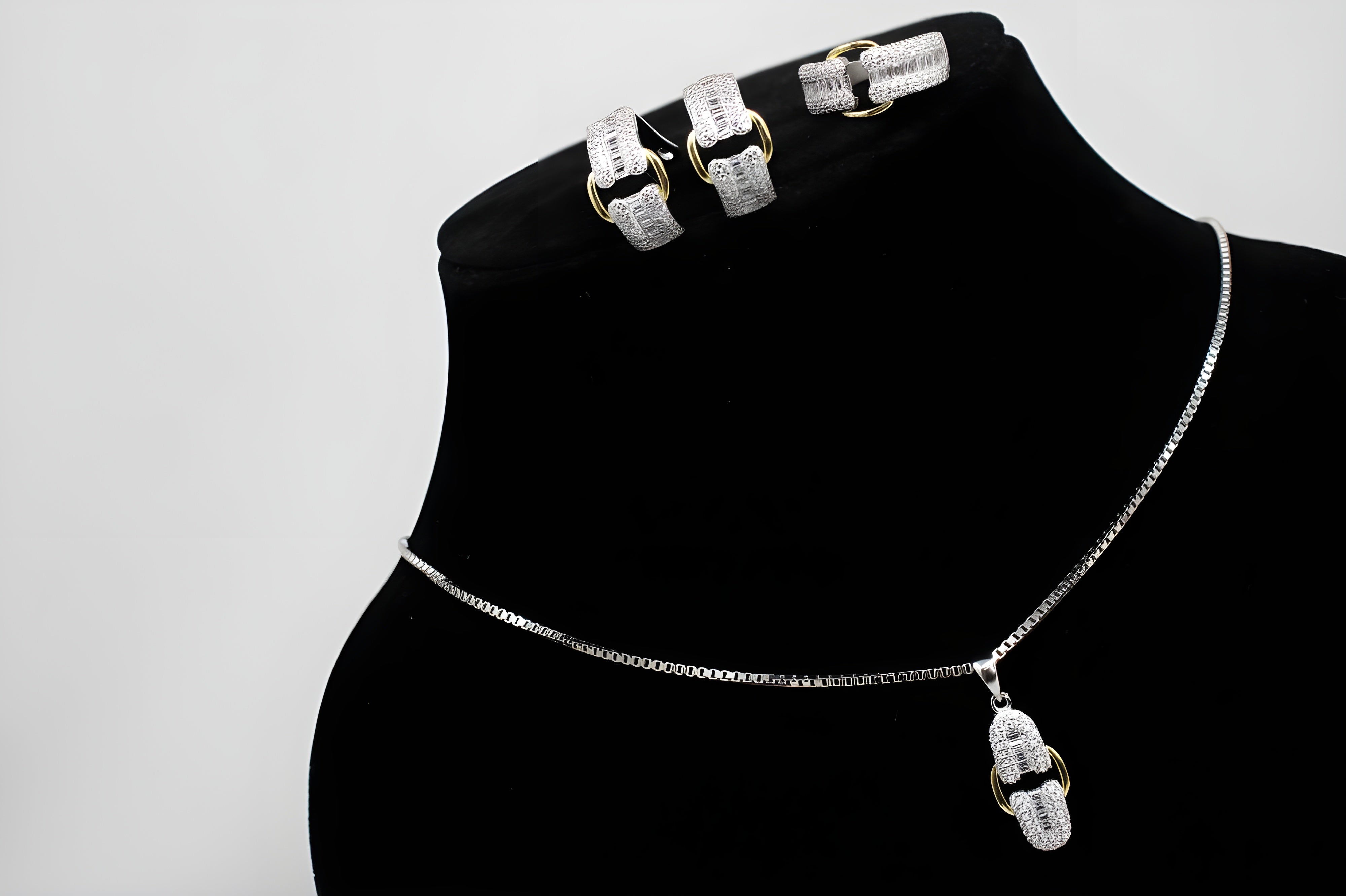 Sterling Silver Buckle Elegance Jewelry Set - Ring, Hoop Earrings & Pendant with Gold Accents and Diamonds