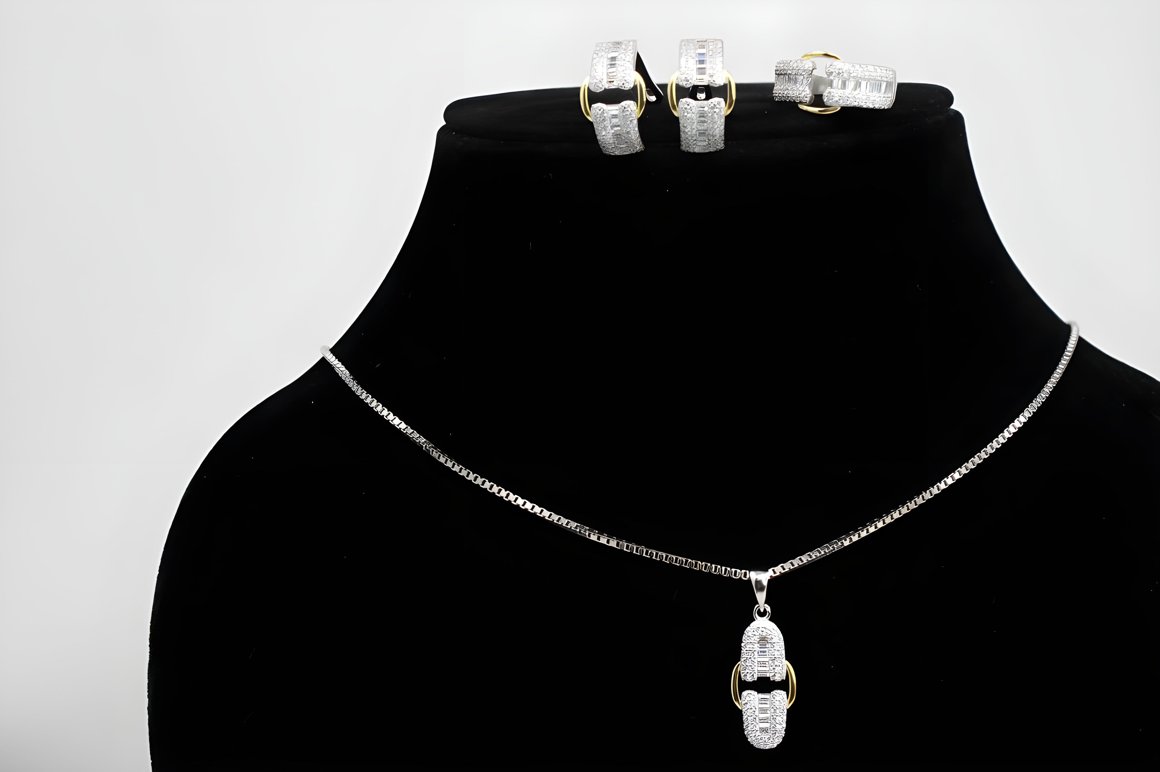 Sterling Silver Buckle Elegance Jewelry Set - Ring, Hoop Earrings & Pendant with Gold Accents and Diamonds