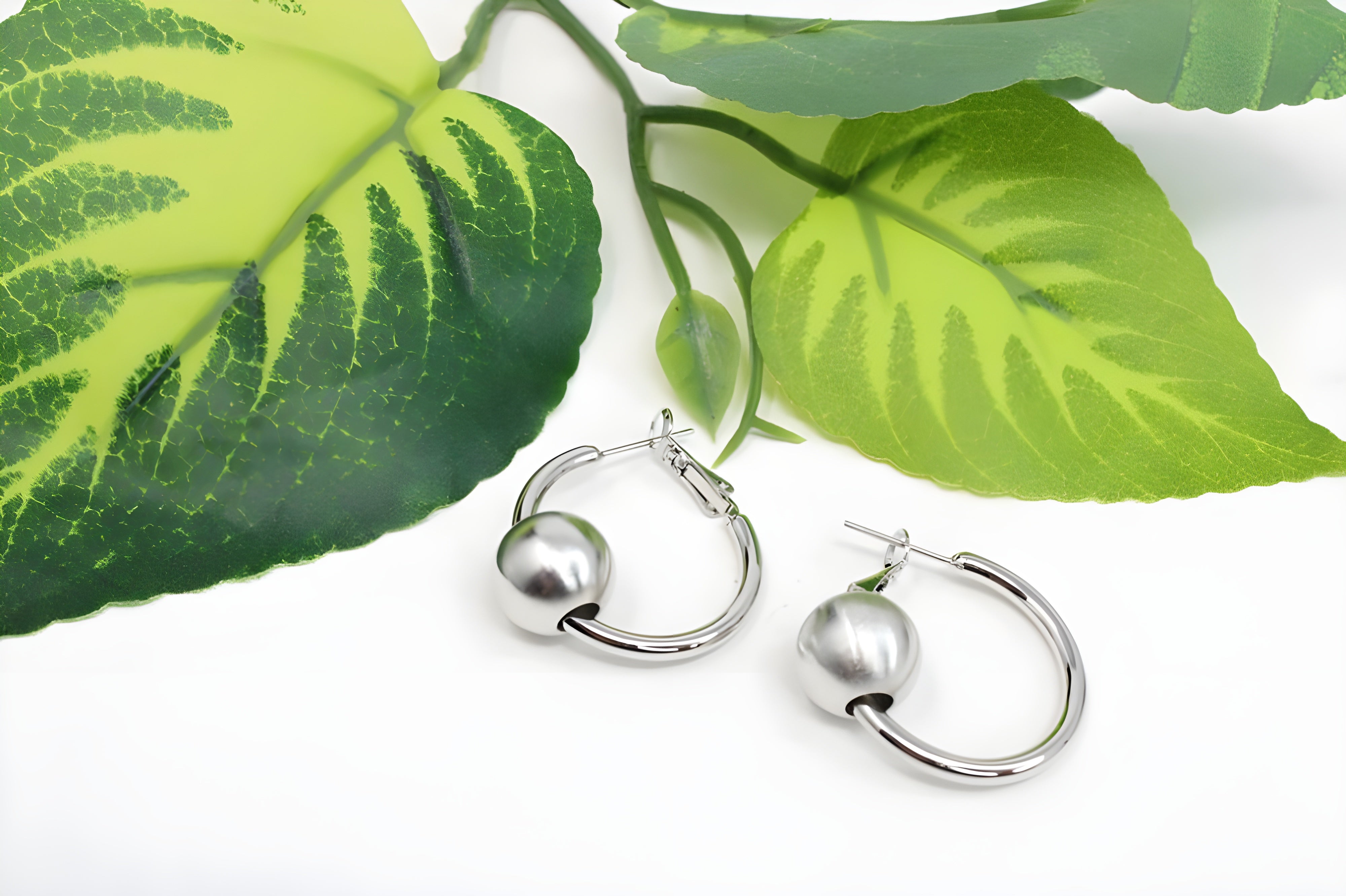 Sleek Silver Hoop Earrings with Charismatic Charm