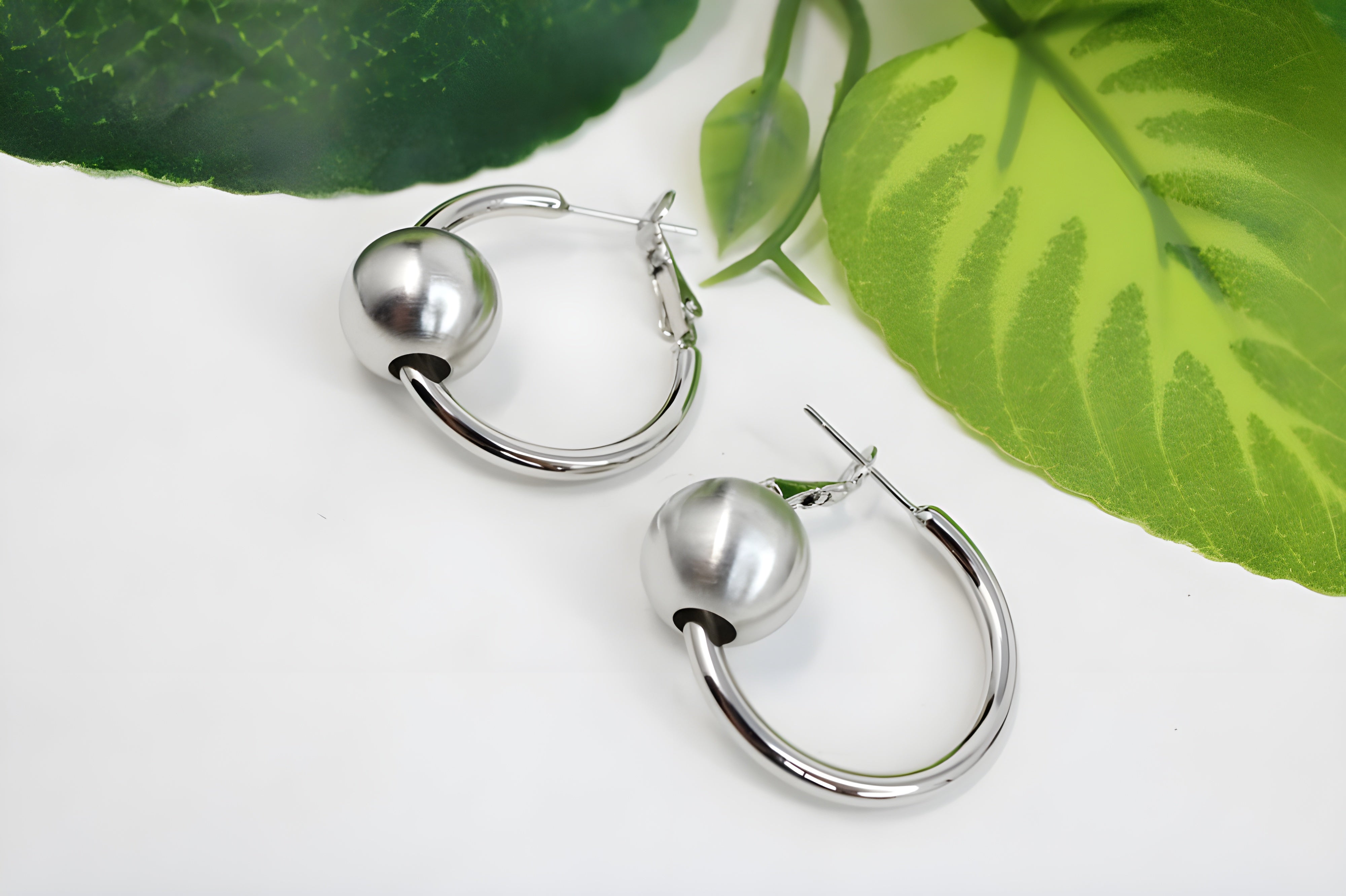 Sleek Silver Hoop Earrings with Charismatic Charm