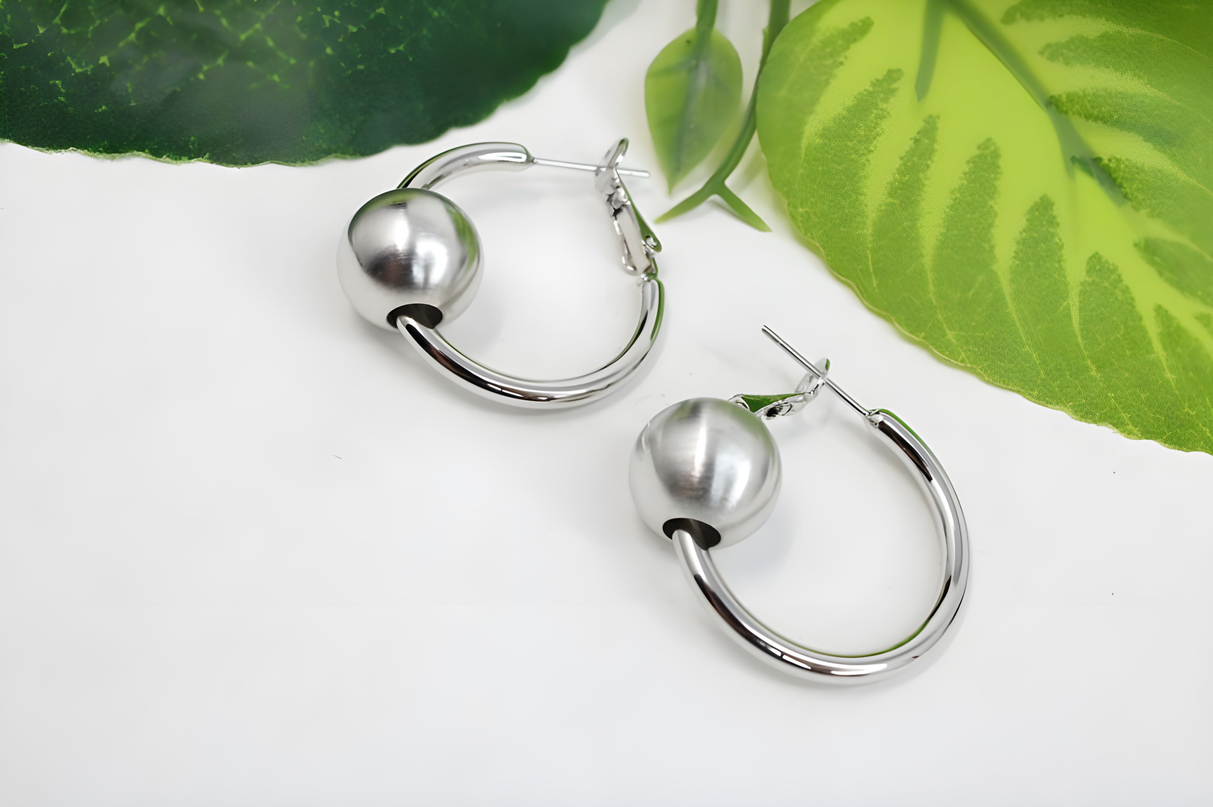 Sleek Silver Hoop Earrings with Charismatic Charm