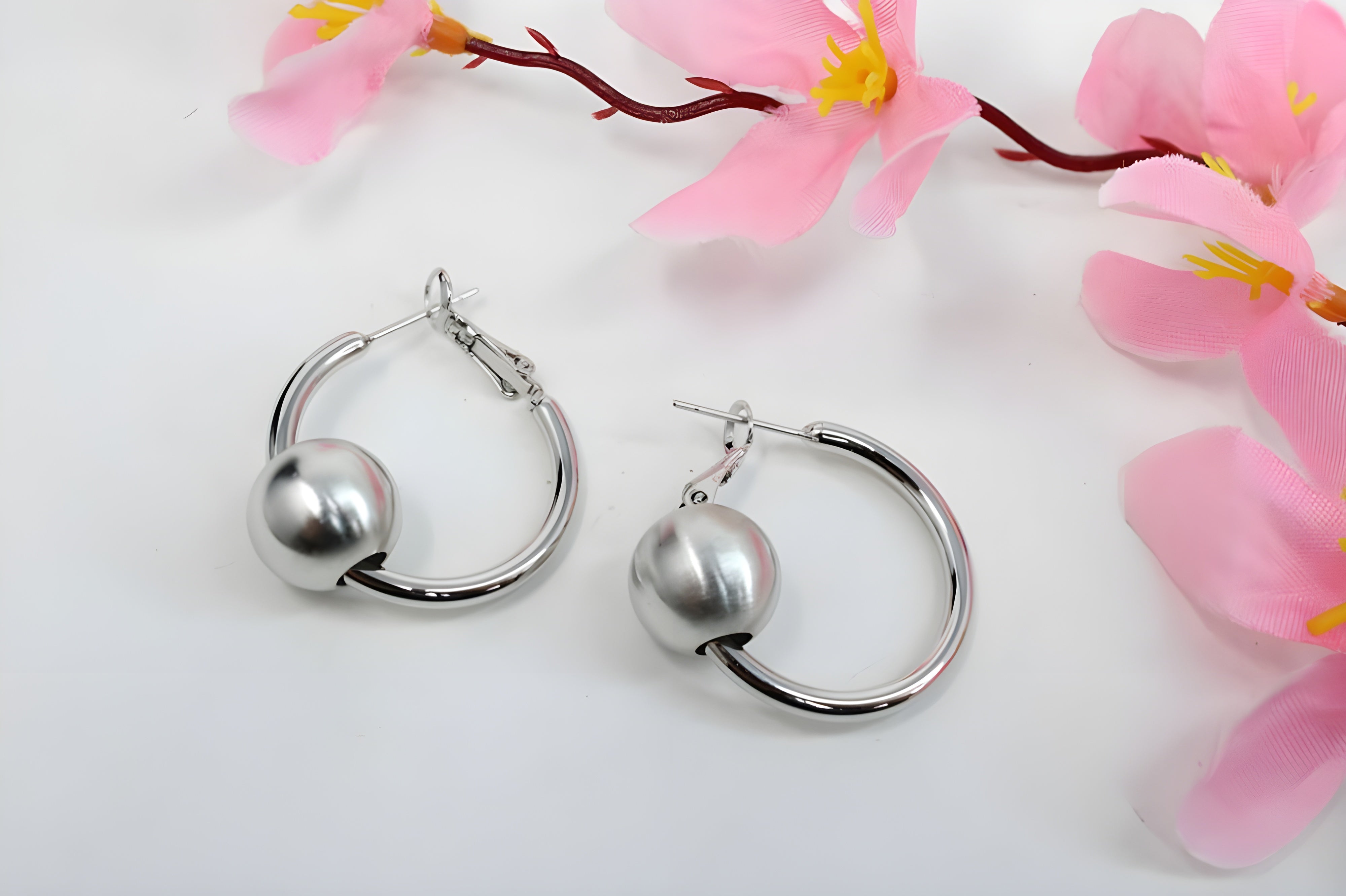 Sleek Silver Hoop Earrings with Charismatic Charm