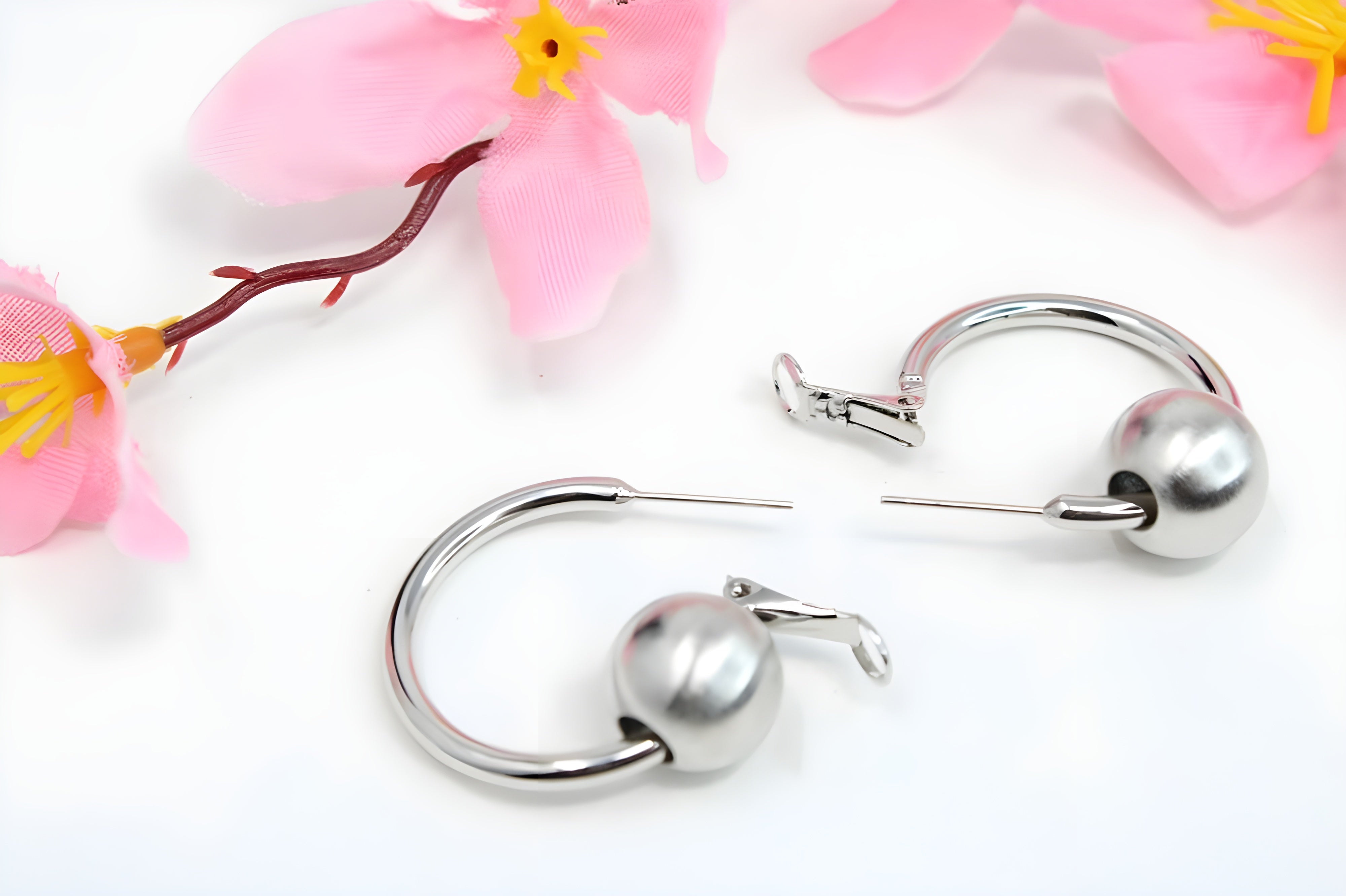 Sleek Silver Hoop Earrings with Charismatic Charm