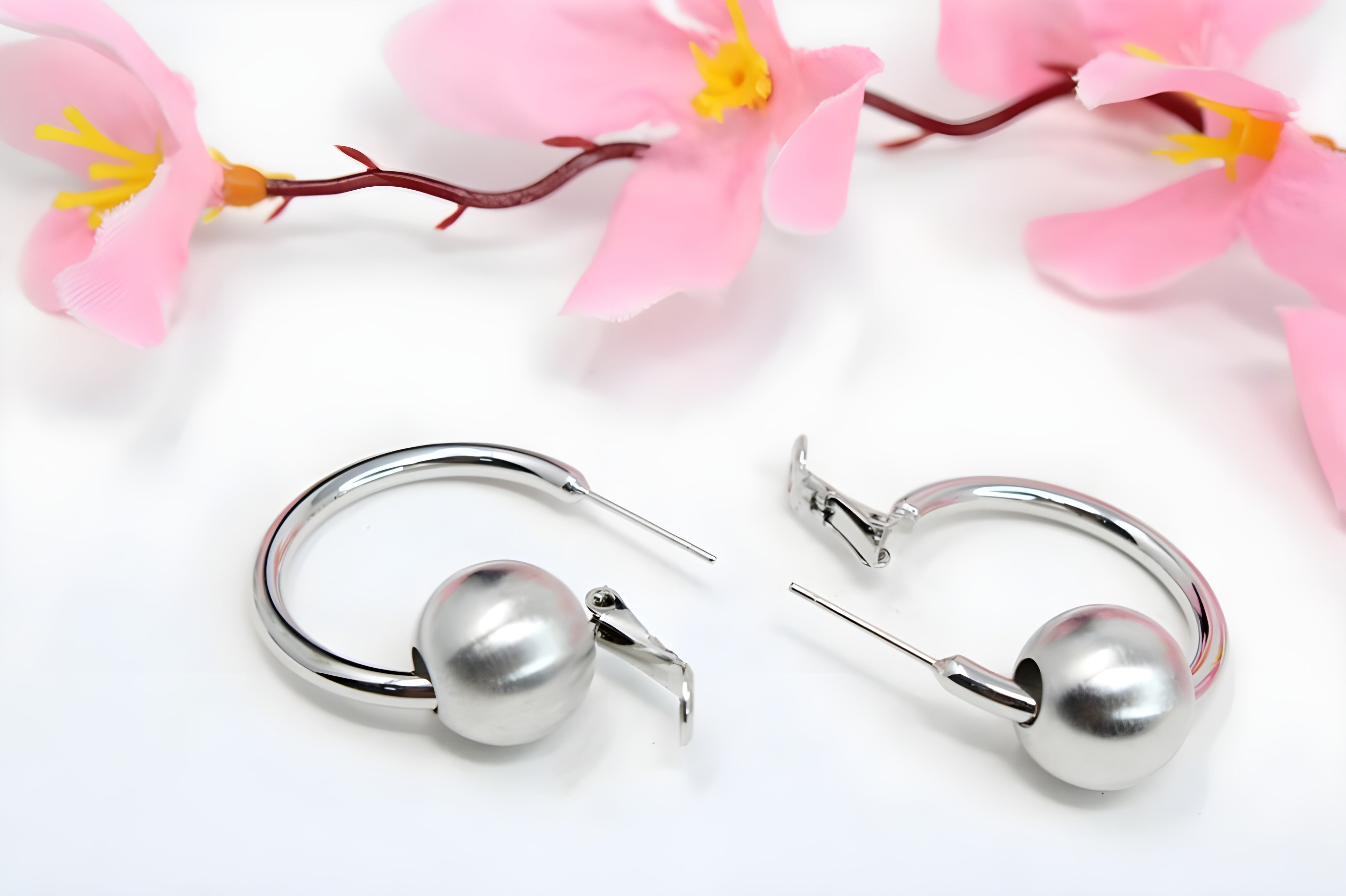 Sleek Silver Hoop Earrings with Charismatic Charm