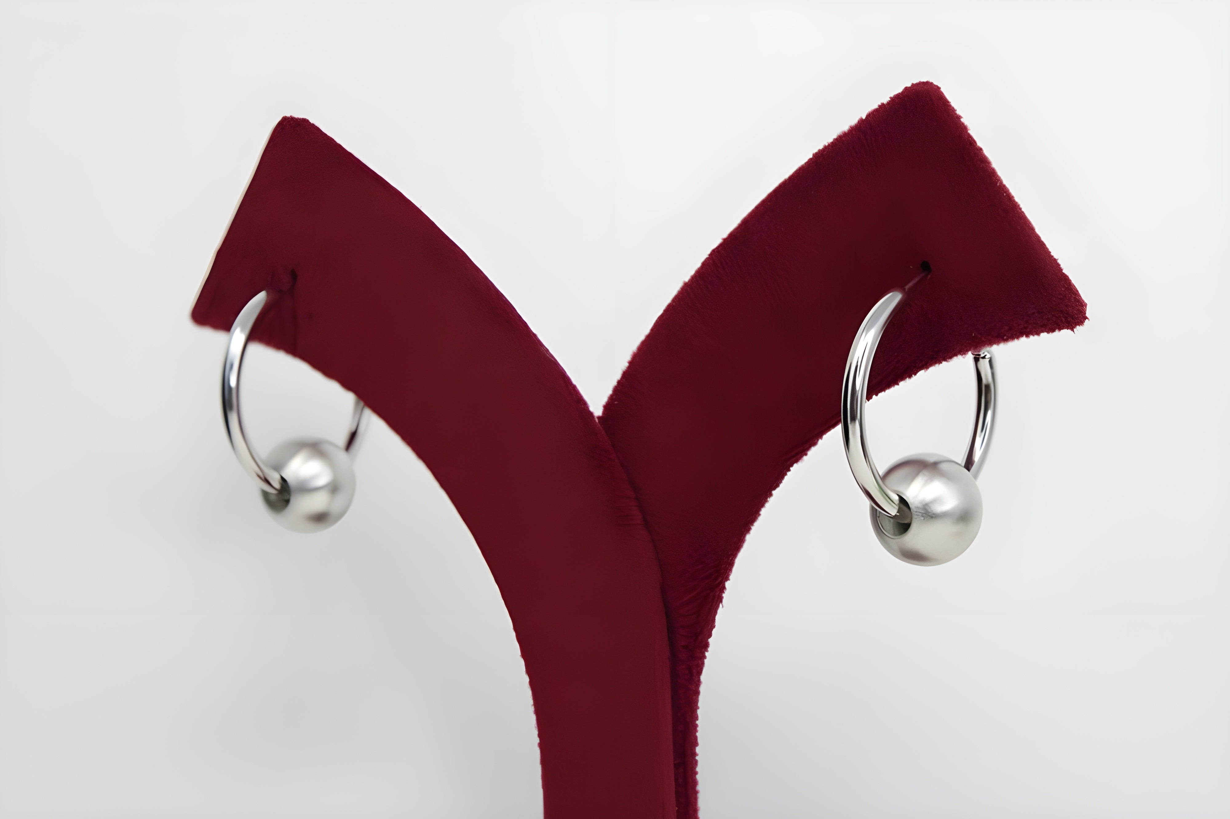 Sleek Silver Hoop Earrings with Charismatic Charm