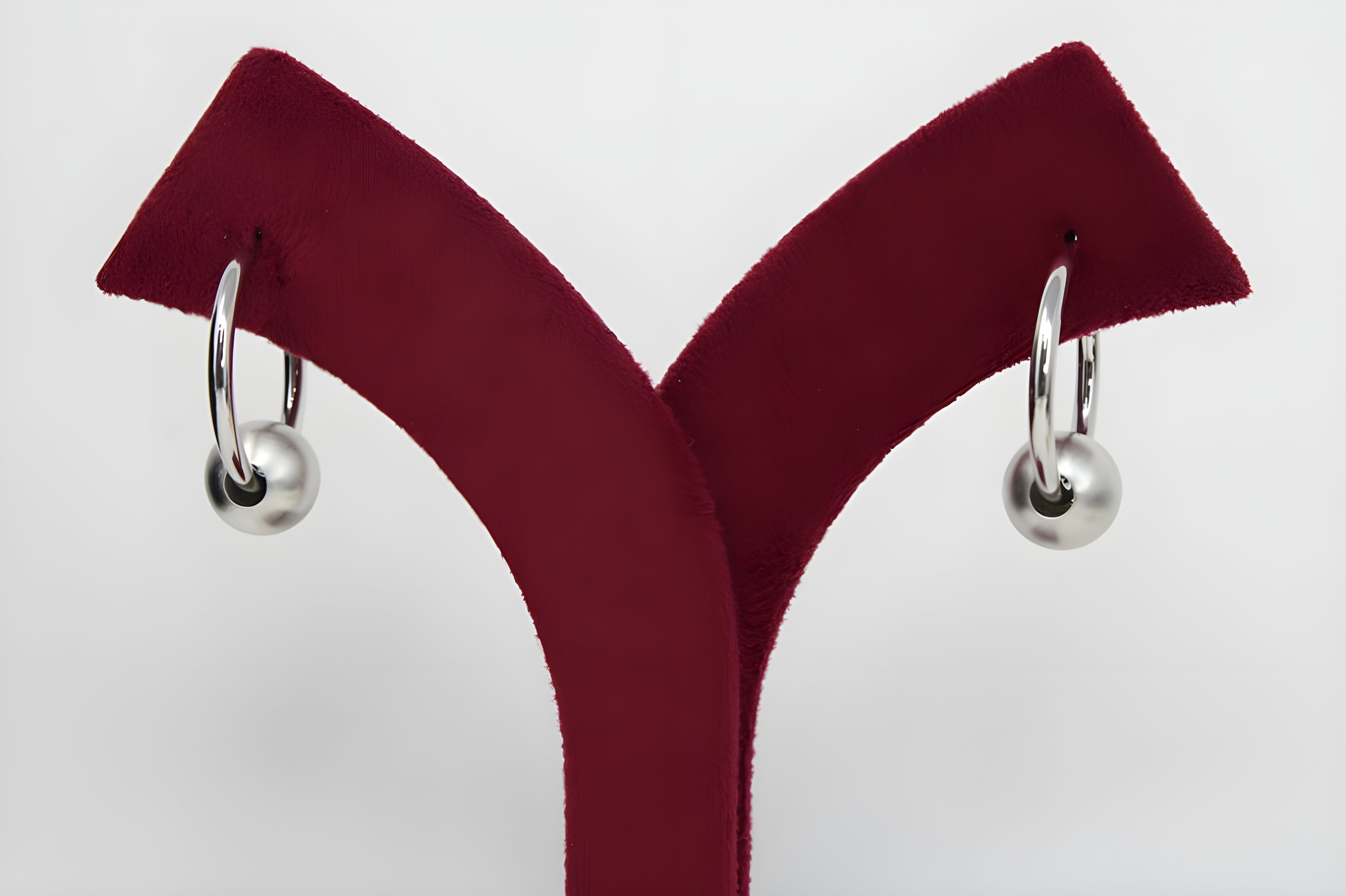 Sleek Silver Hoop Earrings with Charismatic Charm