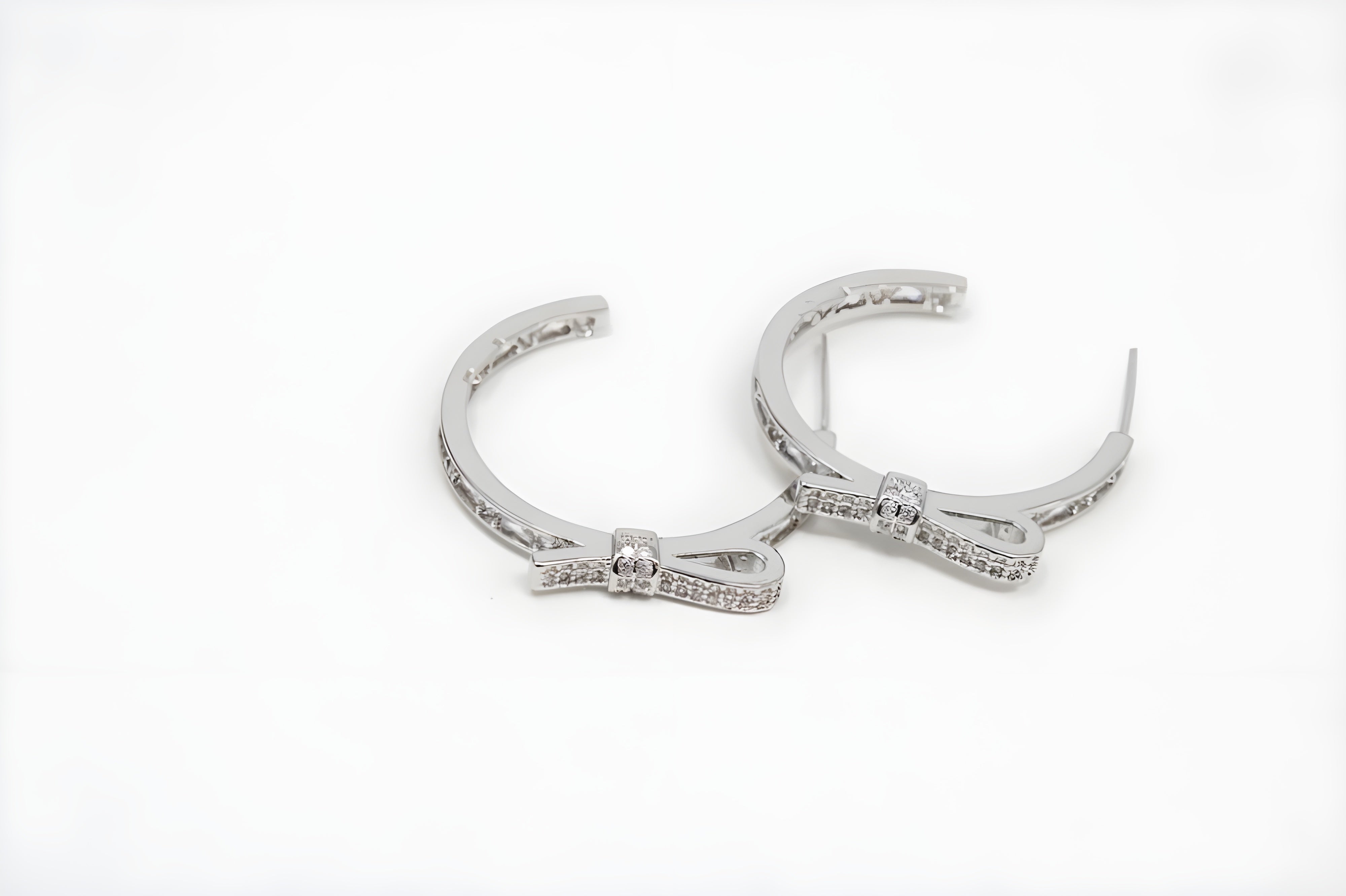 Twinkle Bow Silver Hoop Earrings