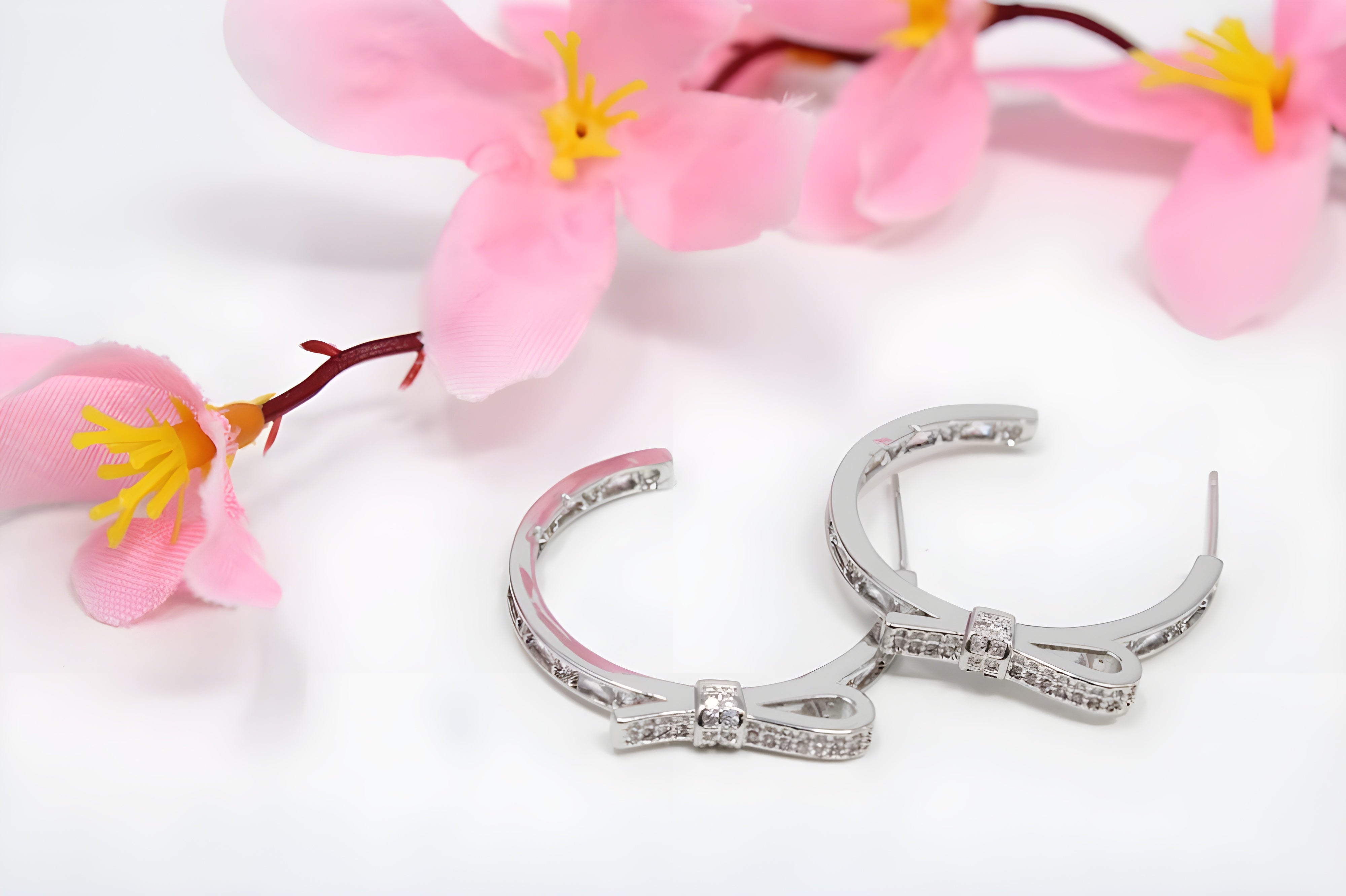 Twinkle Bow Silver Hoop Earrings